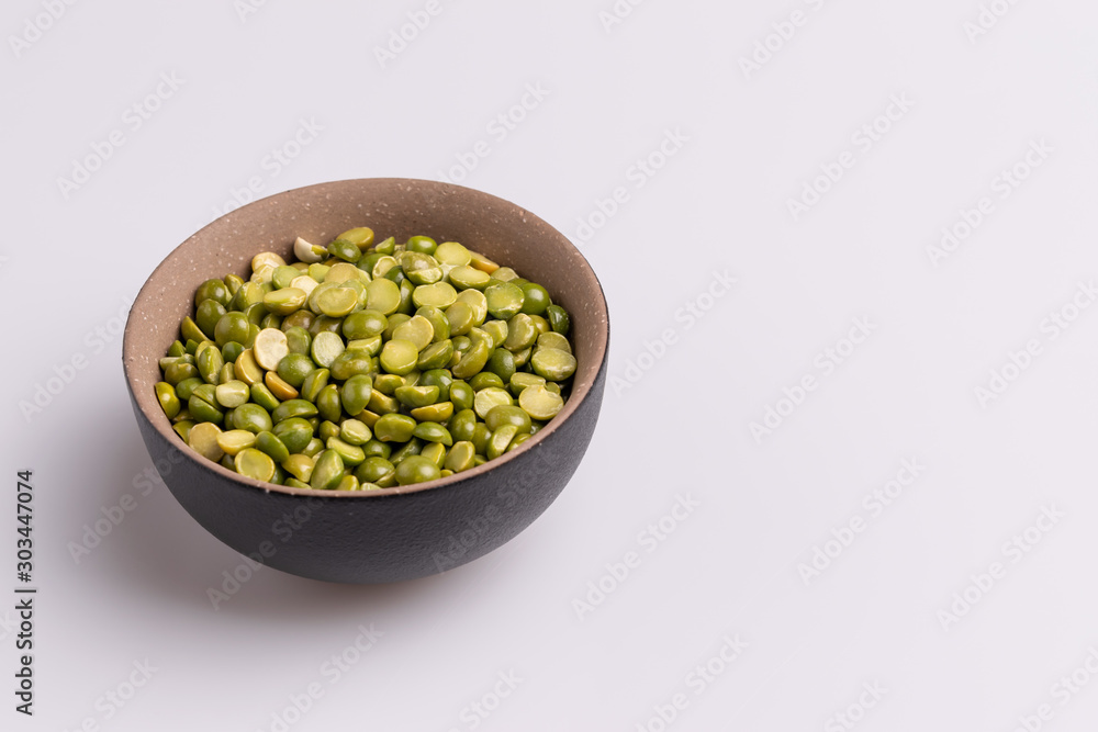Split dried uncooked peas isolated on white background, close-up, studio shot, soft light, copy space. Christmas dish Split dried uncooked peas isolated on white background, close-up, studio shot, soft light, copy space. Christmas dish