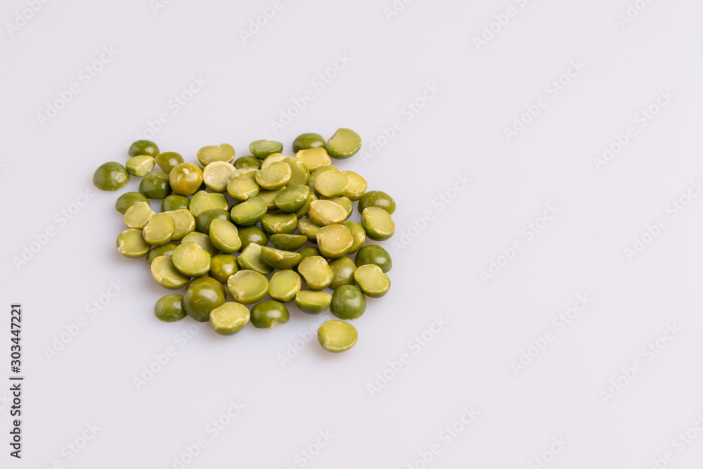 Split dried uncooked peas isolated on white background, close-up, studio shot, soft light, copy space. Christmas dish Split dried uncooked peas isolated on white background, close-up, studio shot, soft light, copy space. Christmas dish