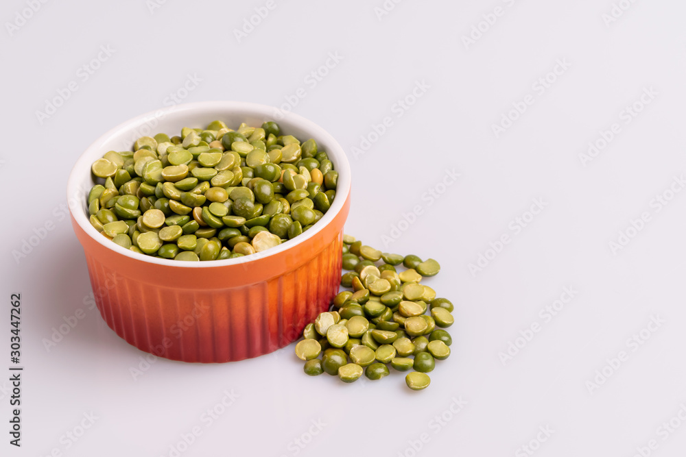Split dried uncooked peas isolated on white background, close-up, studio shot, soft light, copy space. Christmas dish Split dried uncooked peas isolated on white background, close-up, studio shot, soft light, copy space. Christmas dish