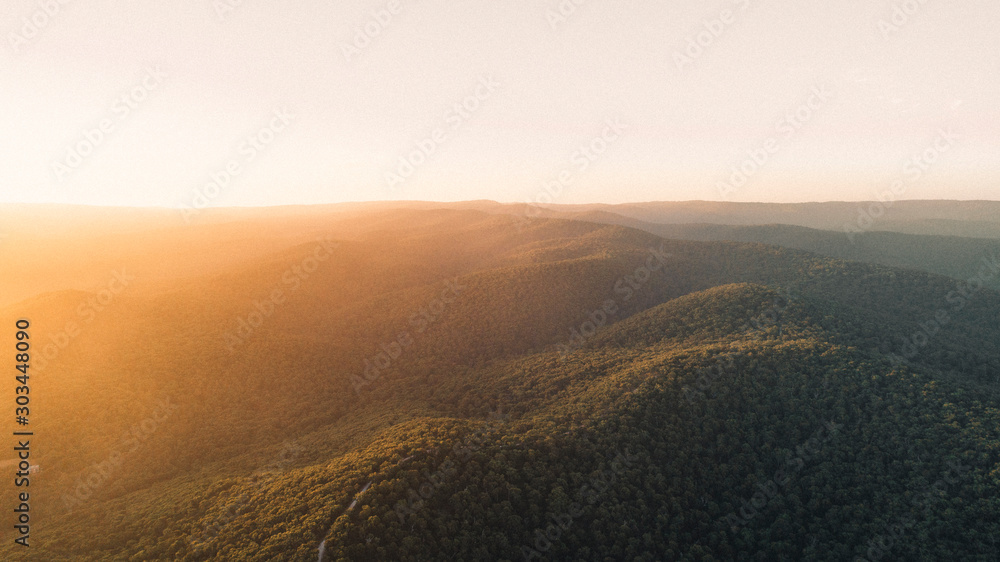 Aerial View of Sunset Over Beautiful Forest Landscape Along the Great Ocean Road, Victoria Australia - obrazy, fototapety, plakaty 