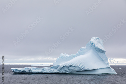 Iceberg floating in Antarctica waters photo