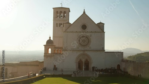 Tracking shot of the Upper Basilica of Saint Francis of Assisi in the Hill of Paradise, Umbria, Italy, a UNESCO Heritage Site photo