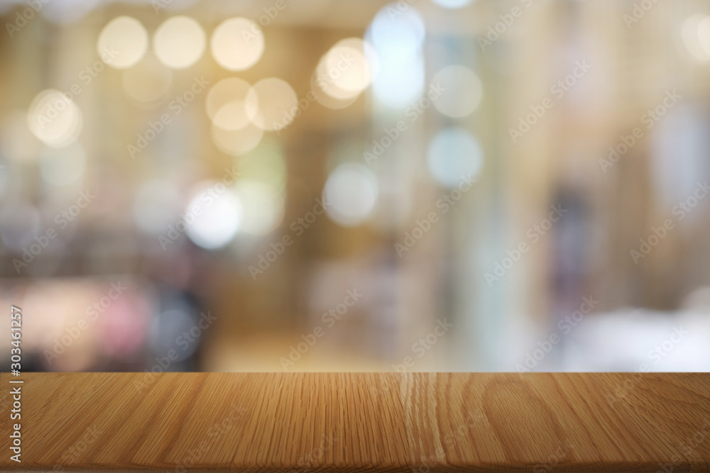 Empty dark wooden table in front of abstract blurred bokeh background of restaurant . can be used for display or montage your products.Mock up for space. Empty dark wooden table in front of abstract blurred bokeh background of restaurant . can be used for display or montage your products.Mock up for space.