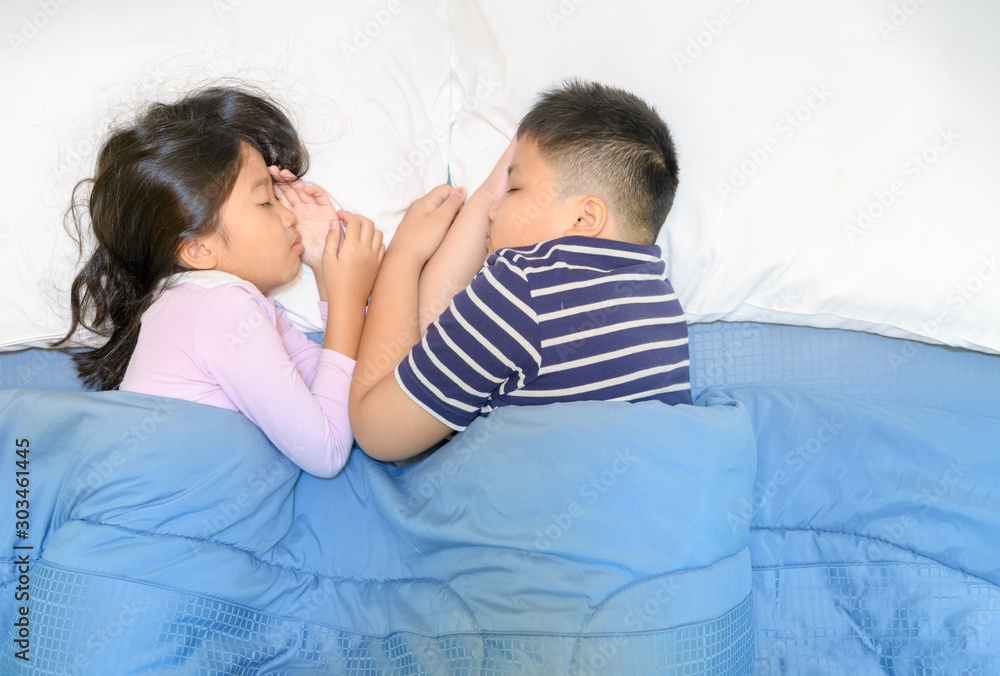 Two children sleep on bed togather, Two children sleep on bed togather,