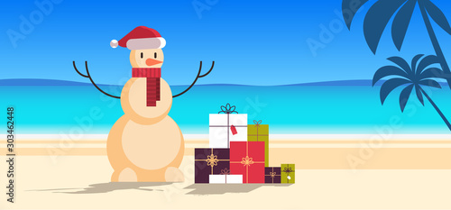 sandy christmas snowman with gift present boxes happy new year vacation holiday celebration concept tropical beach seascape background full length flat horizontal vector illustration