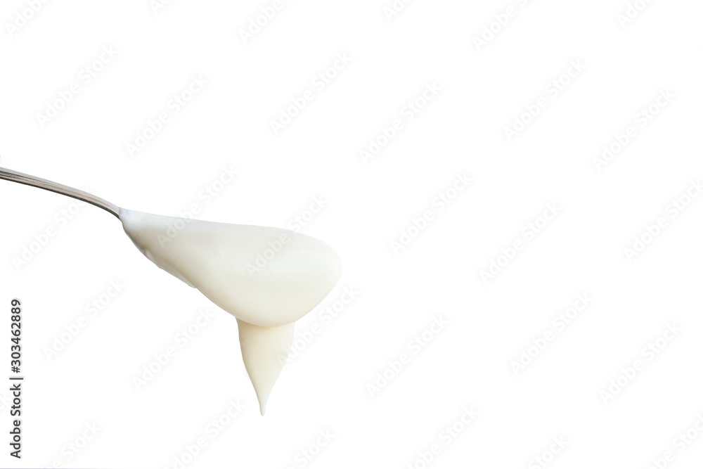 rustic sour cream on a spoon. Isolated on white background rustic sour cream on a spoon. Isolated on white background
