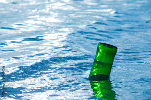 Glass bottle on the lake,garbage on the lake,Trash,pollution from garbage in the sea 