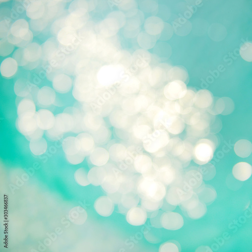 Soft focus bokeh light effects over a rippled