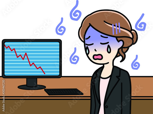 パソコンで下降チャートを見る女性