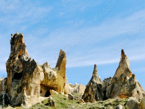 Natural fairy chimneys rock formation in Goreme in Turkey on a beautiful sunny day. Goreme is an international tourism attraction and a region of exceptional natural wonders.