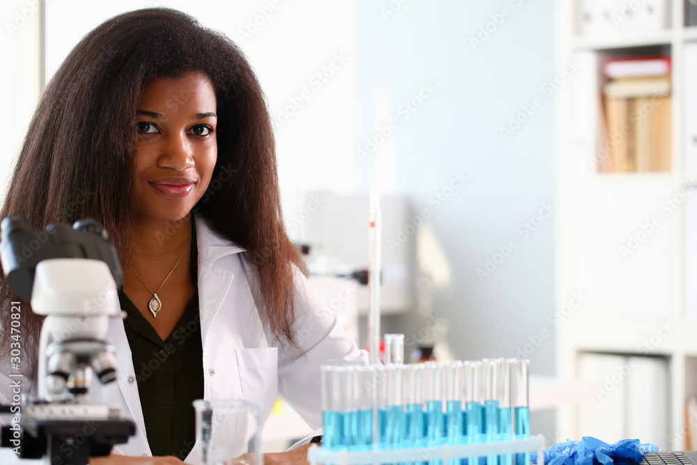Black female chemist student conducting research Black female chemist student conducting research