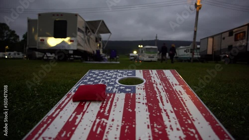 Playing Game of Corn Hole Low Angle photo