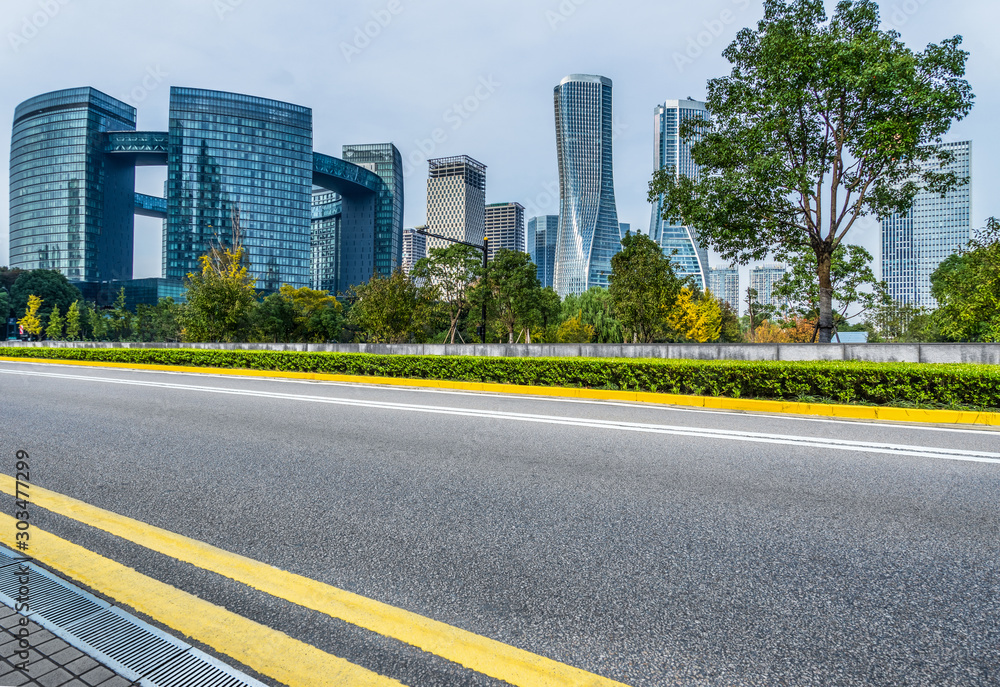 empty asphalt road front of modern buildings. empty asphalt road front of modern buildings.