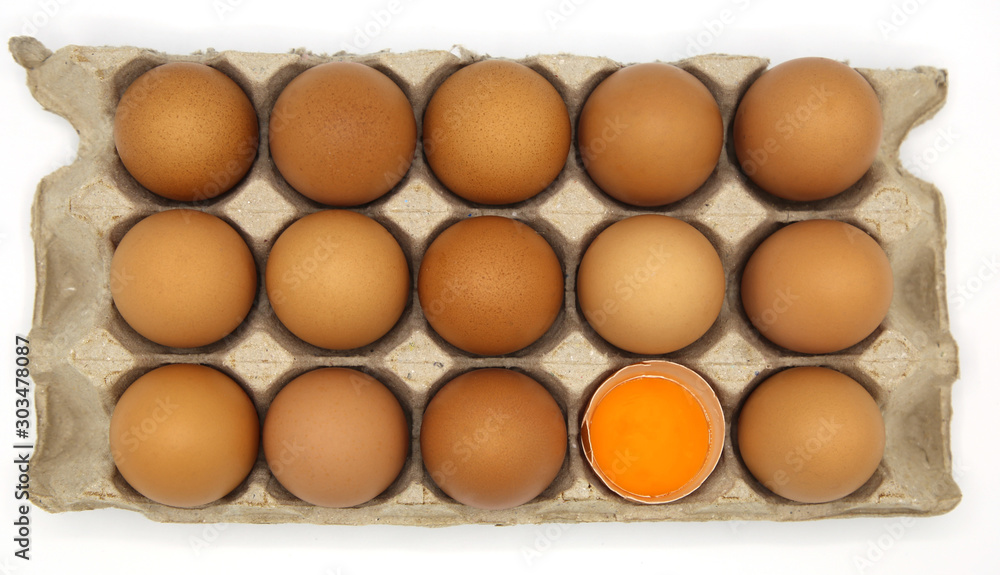 Brown chicken egg in paper box isolated on white background Brown chicken egg in paper box isolated on white background