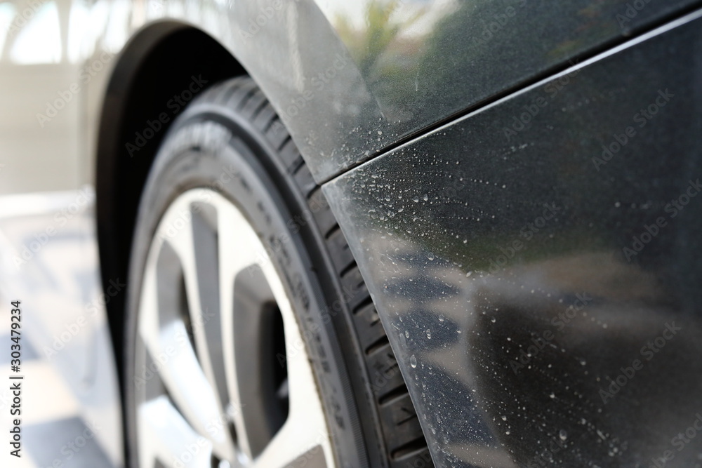 dirty black car with water stained dry dirty black car with water stained dry
