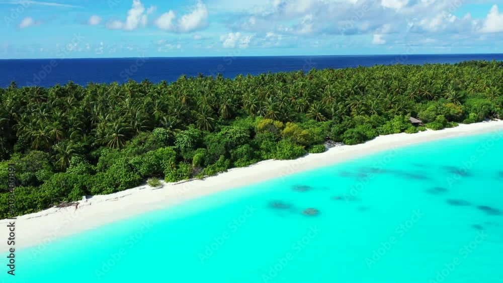 Natural colors of a tropical seascape with bright blue sky, navy blue ocean, green lush vegetation, white beach and azure lagoon Natural colors of a tropical seascape with bright blue sky, navy blue ocean, green lush vegetation, white beach and azure lagoon