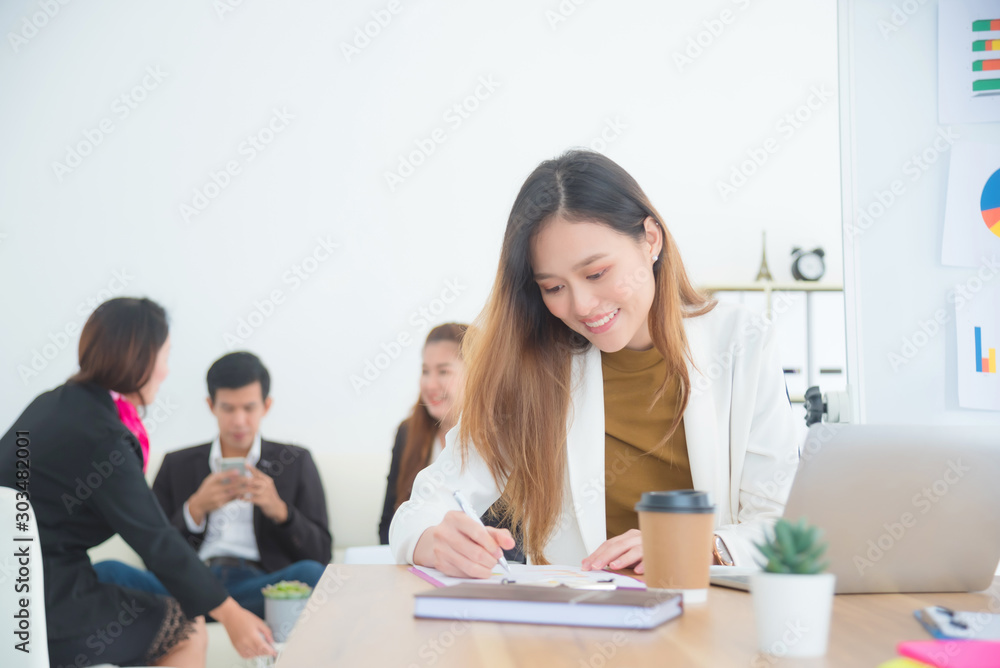 Beautiful asian businesswoman working in office,Female director working in office sitting at desk and analyzing business statistics. Beautiful asian businesswoman working in office,Female director working in office sitting at desk and analyzing business statistics.