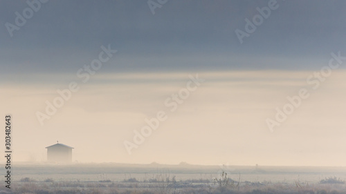 Obraz na płótnie Outpost surrounded by fog on a early November morning w salonie