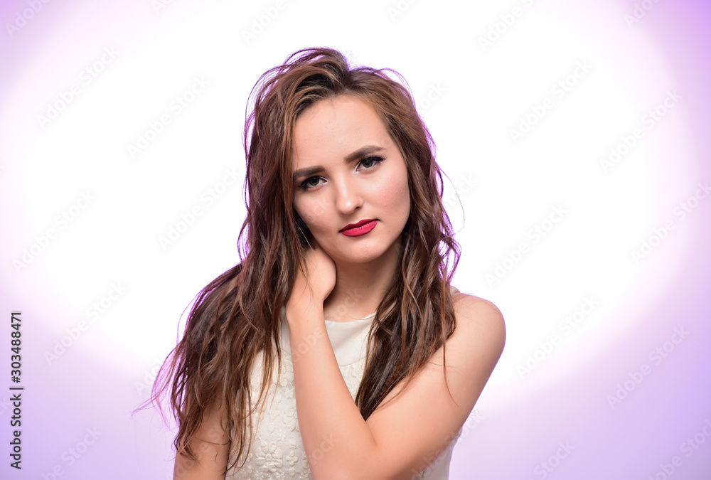 The concept of beauty, fashion, makeup, cosmetics. Portrait of a pleasant young pretty brunette girl with a beautiful hairstyle, great makeup, long curly hair on a colorful background. The concept of beauty, fashion, makeup, cosmetics. Portrait of a pleasant young pretty brunette girl with a beautiful hairstyle, great makeup, long curly hair on a colorful background.