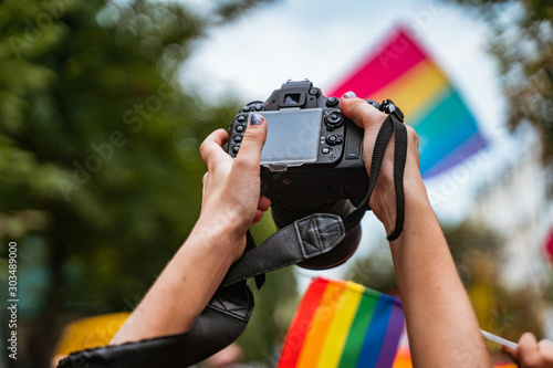 Correspondent takes photo during the Gay Pride parade photo