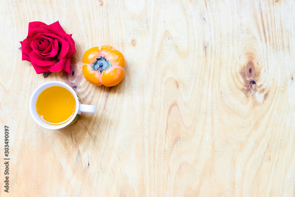 Fresh banana and persimmon in brick wall background and wooden table, Fresh banana and persimmon in brick wall background and wooden table,