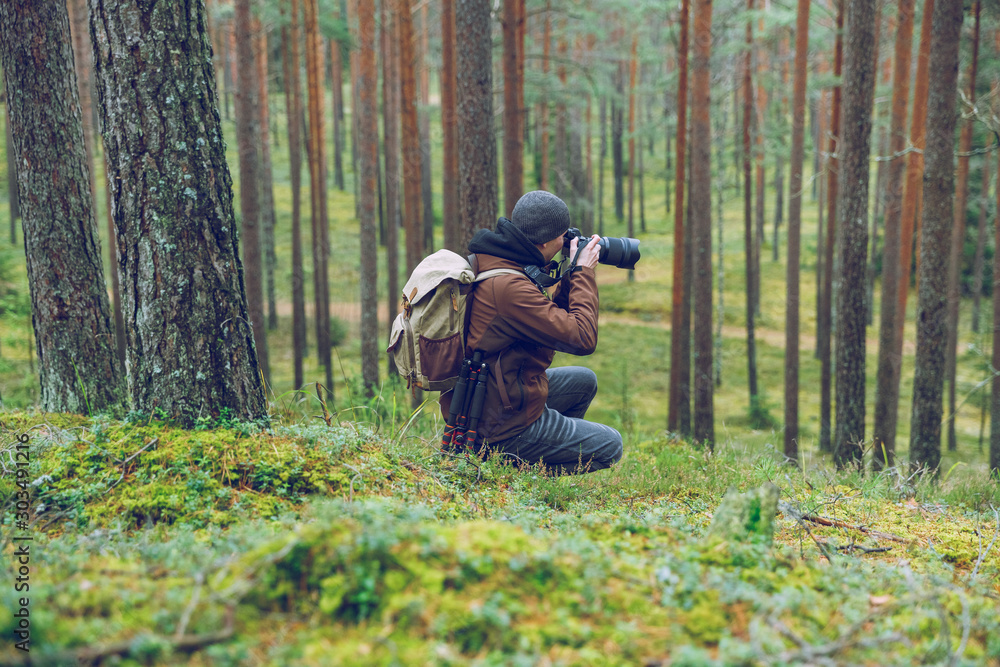 City Cesis, Latvia republic. The photographer is still photographing the forest landscape. 2. november 2019. City Cesis, Latvia republic. The photographer is still photographing the forest landscape. 2. november 2019.