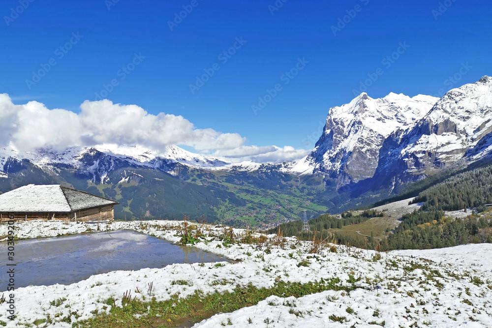 Peak of Switzerland Grindelawld snow mountain with cloud and wooden house