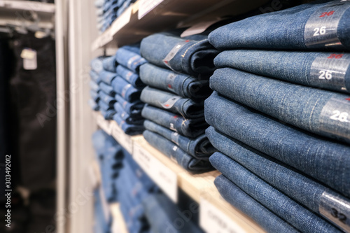 Clothing store. Classic jeans on the shelves.