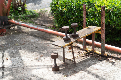 Diy metal iron dumbbell on a outdoor fitness gym floor