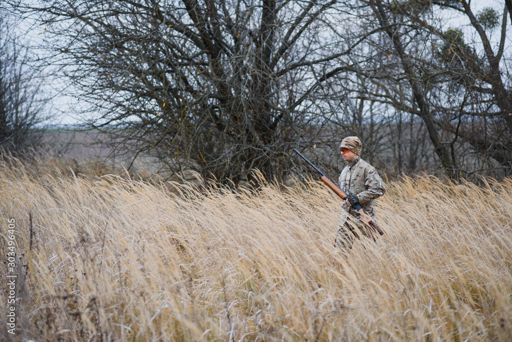 Hunting permit. Man brutal gamekeeper nature background. hunter spend leisure hunting. Hunter hold riffles. Focus and concentration of experienced hunter. Hunting and trapping seasons. Hunting permit. Man brutal gamekeeper nature background. hunter spend leisure hunting. Hunter hold riffles. Focus and concentration of experienced hunter. Hunting and trapping seasons.