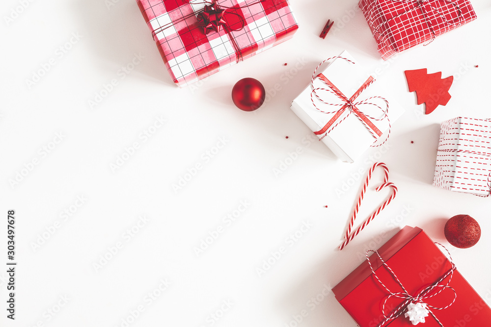 Christmas composition. Gift box, christmas decorations on white background. Flat lay, top view, copy space - obrazy, fototapety, plakaty 