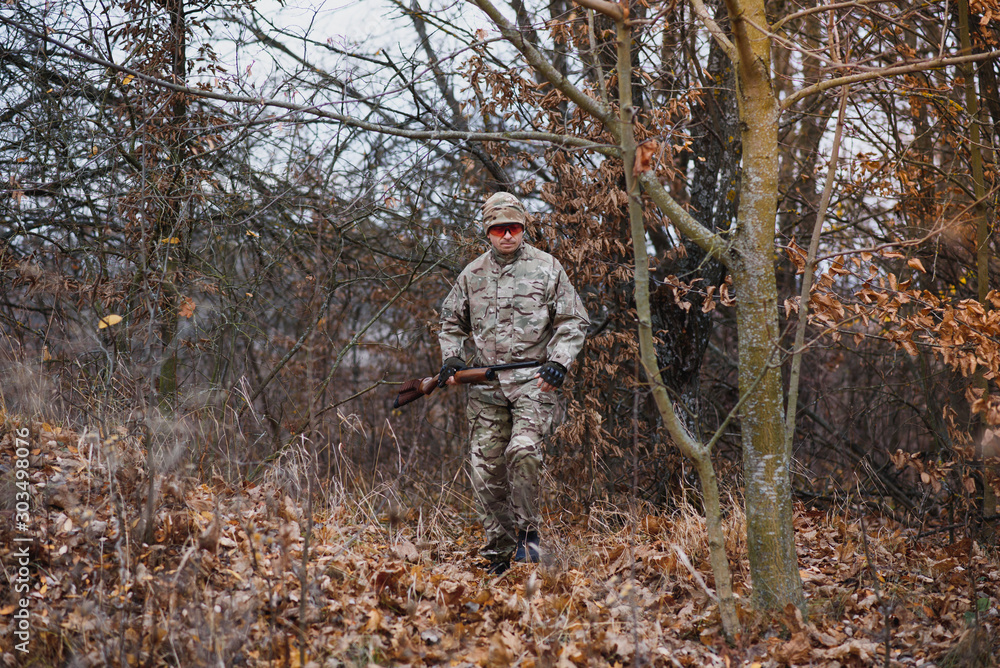 Hunting permit. Man brutal gamekeeper nature background. hunter spend leisure hunting. Hunter hold riffles. Focus and concentration of experienced hunter. Hunting and trapping seasons.