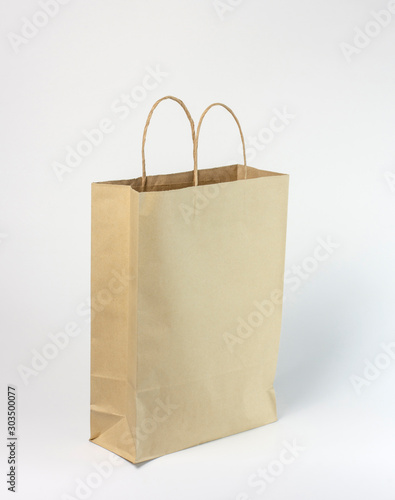 Brown paper shopping bag on white background.Recycled paper bag.