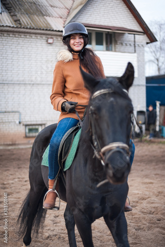 Training women and horses while walking on the racetrack. © Evgeny Leontiev