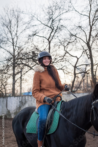 Training women and horses while walking on the racetrack. © Evgeny Leontiev