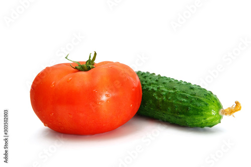 Delicious red tomato and cucumber isolated on a white background.