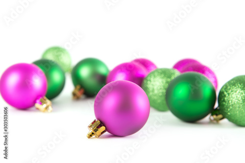Group of green and lilac Christmas balls isolated on white background
