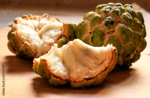 Sugar apple or sweetsop in matte brownish background photo