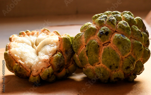 Sugar apple or sweetsop in matte brownish background photo