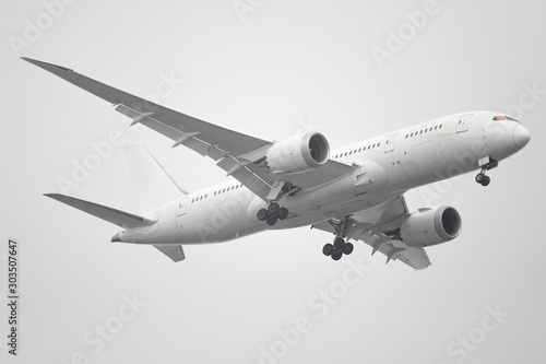 Unspecified white plane isolated on white background.
