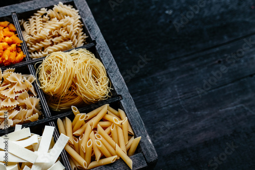 italian pasta in a box. Raw pasta. Farfale, cappelli angelo, spaghetti, cavatelli, noodles photo