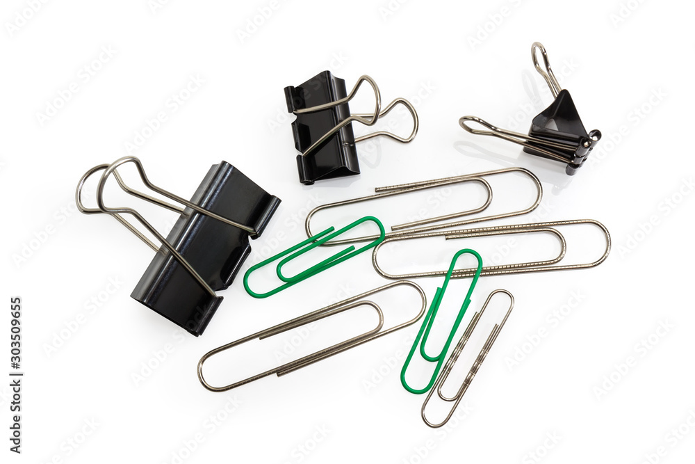 Binder clips and traditional paper clips different sizes, top view Binder clips and traditional paper clips different sizes, top view