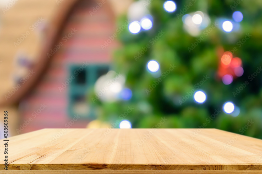Empty wood table top with Abstract blur Christmas tree with decoration bokeh light background for product display Empty wood table top with Abstract blur Christmas tree with decoration bokeh light background for product display