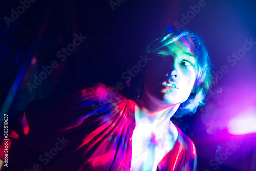 Psychedelic portrait of a girl with multi-colored lights.
