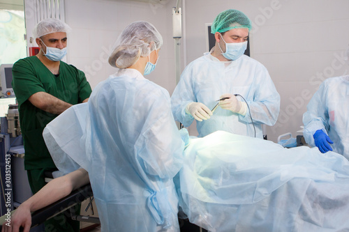 Team of surgeons doing surgery