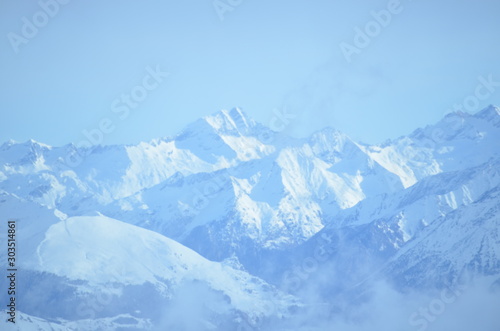 vista at mountain top French alps ice grey snow sky view © Alexandra Griffiths