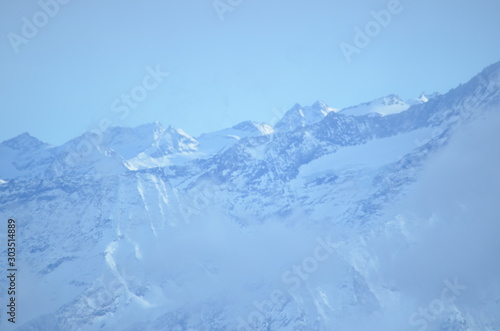 vista at mountain top French alps ice grey snow sky view © Alexandra Griffiths