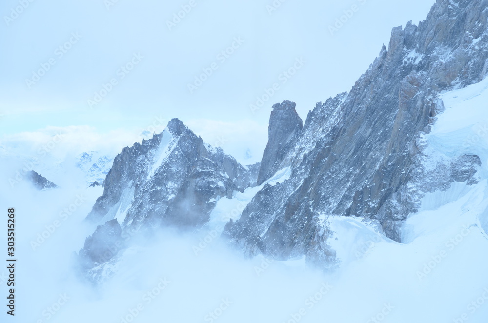 vista at mountain top French alps ice grey snow sky view
