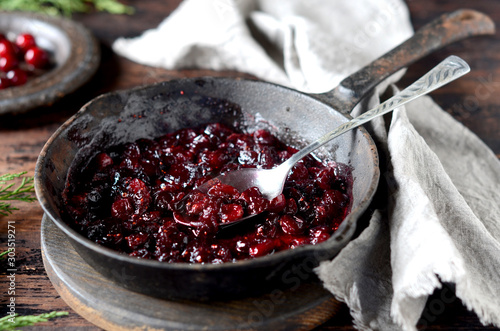 Cranberry sauce in a pan, christmas, rustic