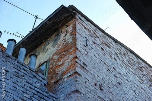 Wall of an old building with brickwork, background